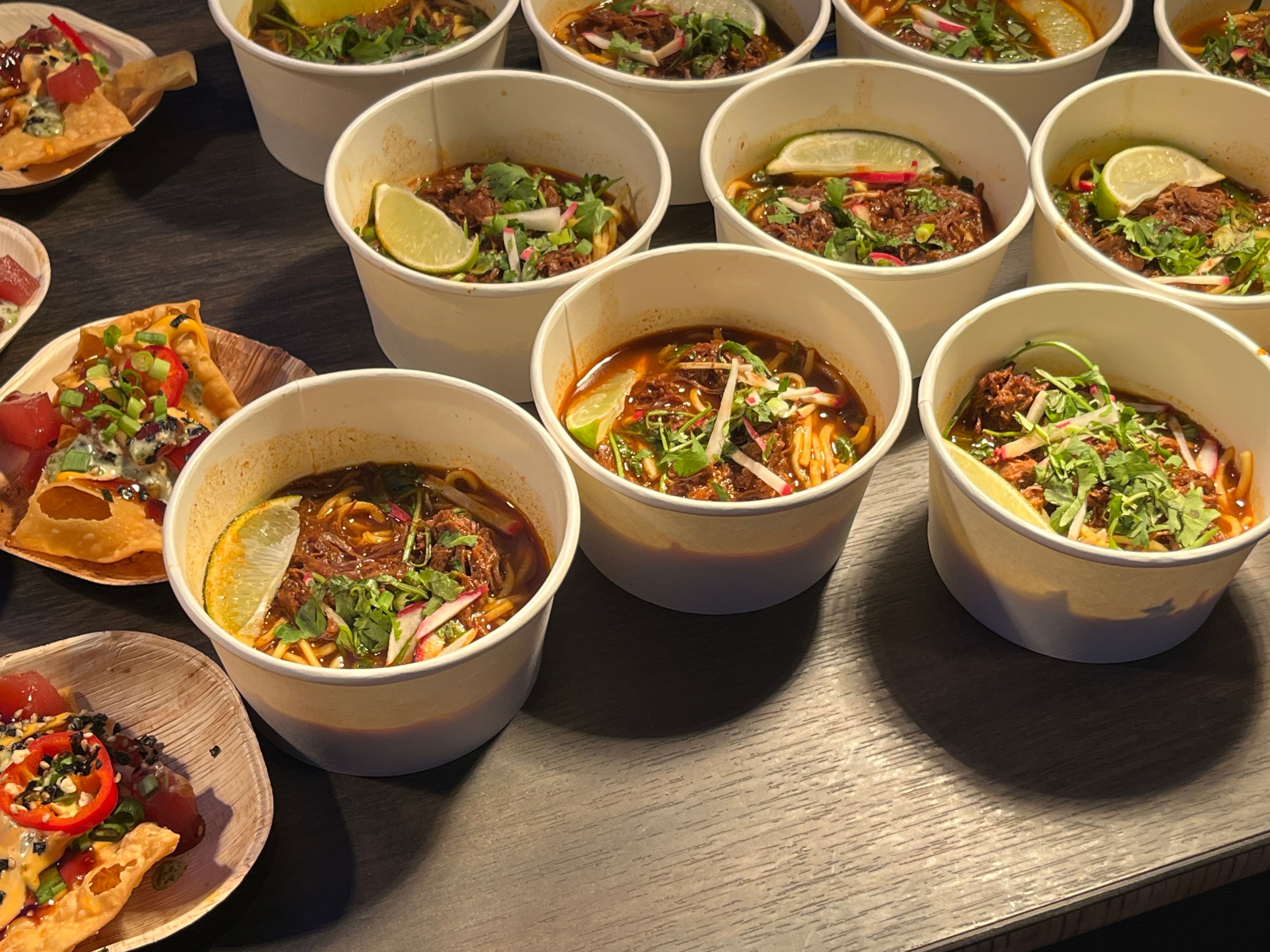 Bowls of a meat and noodle soup.