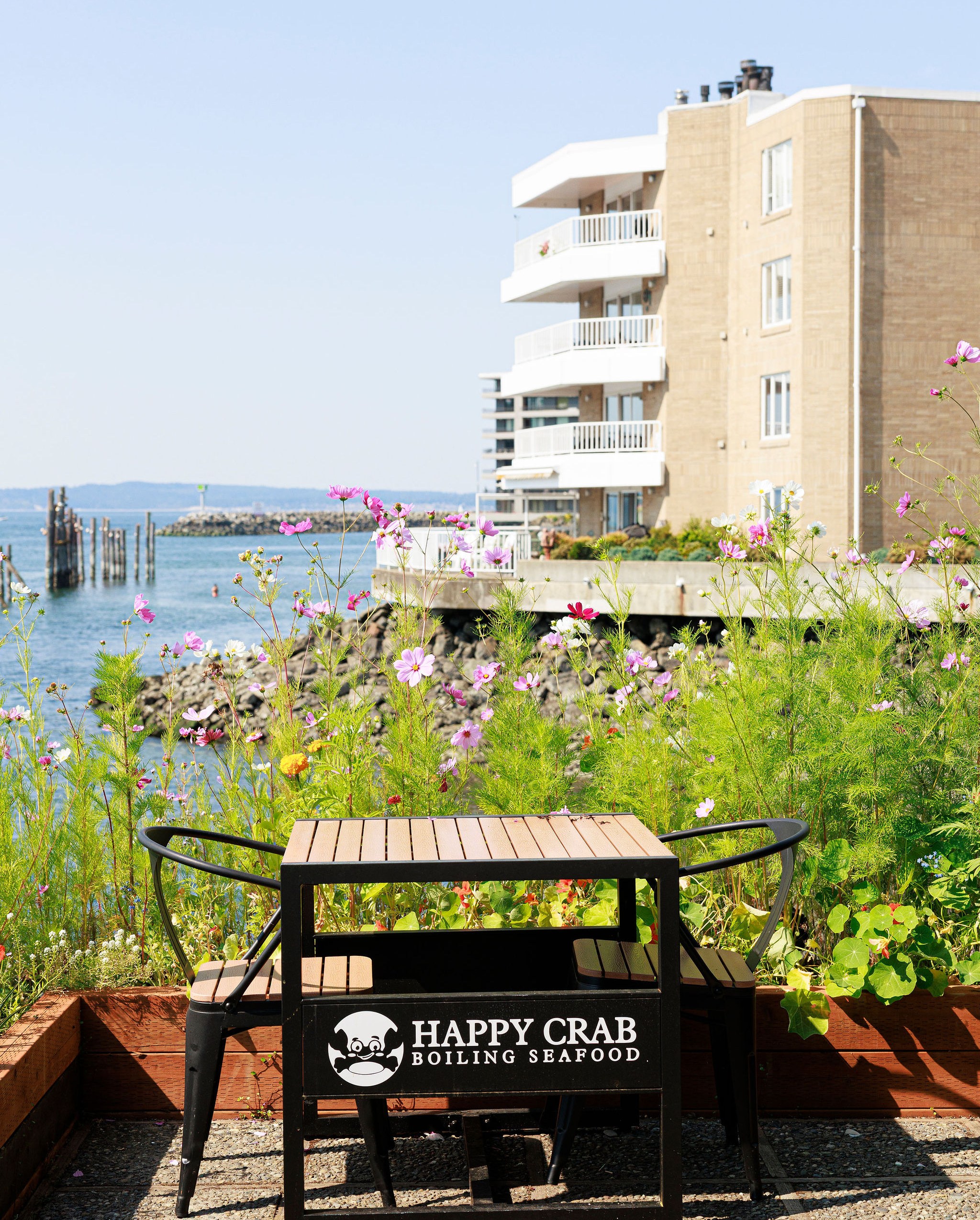 A table on a waterfront deck at a restaurant.